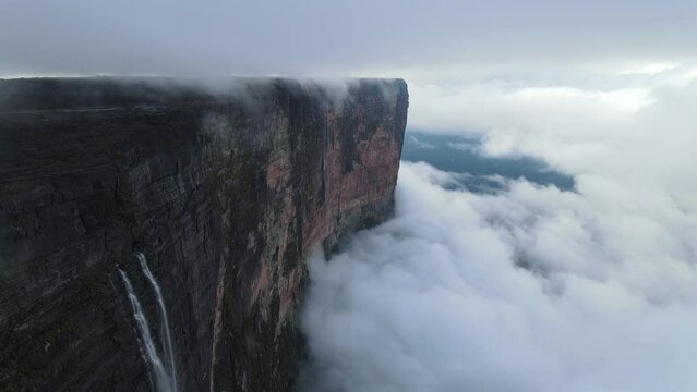 Cinematic aerial view of Tepuy Roraima huge wall mountain with waterfalls, Venezuela, Canaima National Park, South America