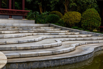 White stone stairs in a landscaped garden