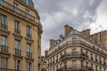 sight of old buildings in Paris against rain clouds