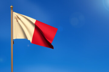 Malta. Flag blown by the wind with blue sky in the background.