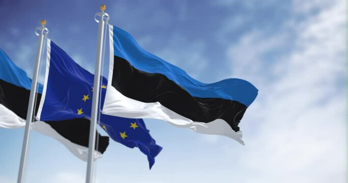 Seamless loop in slow motion of Estonia and the EU flags waving on a clear day
