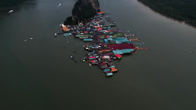 Koh Panyee Floating Fishing Village in Phang Nga, Thailand - Aerial tilt reveal