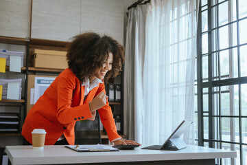 Working smart, African american business woman working audit balance sheet, job order costing,...