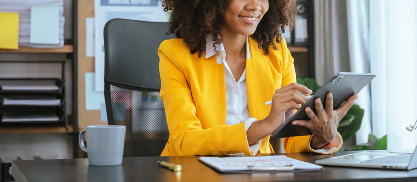 Working smart, African american business woman working audit balance sheet, job order costing, revenue recognition, break-even analysis, appropriated retained earnings, earned surplus, capital gain - Powered by Adobe