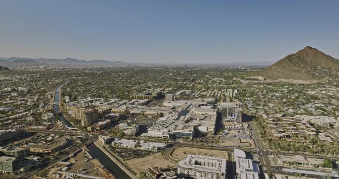 Scottsdale Arizona Aerial v3 drone reverse flyover villa monterey residential housing neighborhood capturing downtown cityscape with camelback mountain view - Shot with Mavic 3 Cine - February 2022