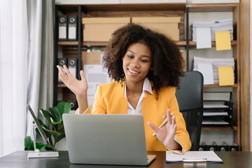 Businesswoman involved in laptop call conversation working on computer, giving professional consultation to client or negotiating project.