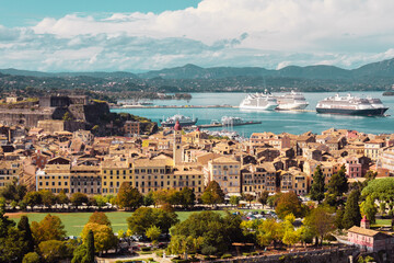Fototapeta na wymiar Panoramic view of the city on the island of Corfu in Greece. Port with ships, the sea and the streets of the old city in the light of the sun