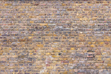 Old weathered brick wall texture. Grunge urban street brick wall
