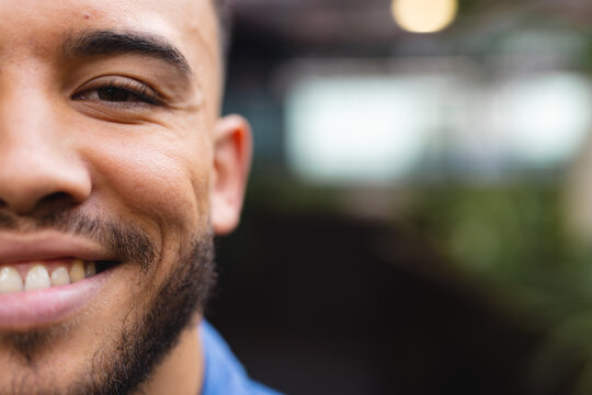 Close Up Portrait Of Happy Biracial Businessman Looking At Camera And Smiling At Office, Unaltered