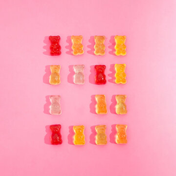 Gummy bears on pink background.  Minimal concept. Flat lay.