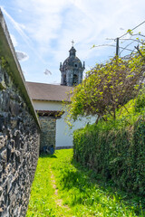Areso town in the Sierra de Aralar next to Leiza in Navarre. La Parroquia La Asuncion at the top of...