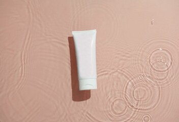 White toothpaste tube isolated on a light pastel background
