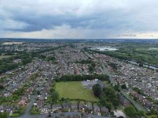 Bird's-eye view of a suburban area under a cloudy sky