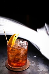 Americano cocktail with a play of light painting in the background