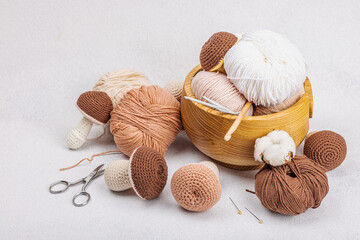 Set of clew of thread for knitting. Crocheted mushrooms, handmade, hobby concept. Props