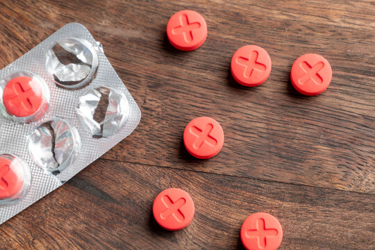 Red pills with a cross mark. Dangerous pills.