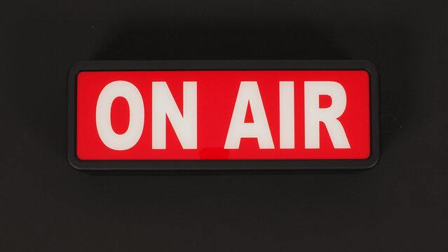 On air neon sign on black background.