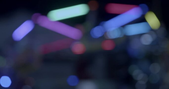 Funfair machine turning around with neon lights