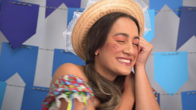 Festa Junina: party in Brazil, close up of brazilian woman dancing at traditional festival in traditional clothes