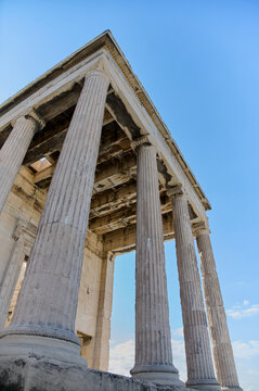 Ancient temple Parthenon in Acropolis Athens Greece on a bright blue sky background. The best travel destinations. Vertical photo.