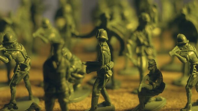 Military company toy soldiers in motion. Violence war resistance and peace without armored invasion
