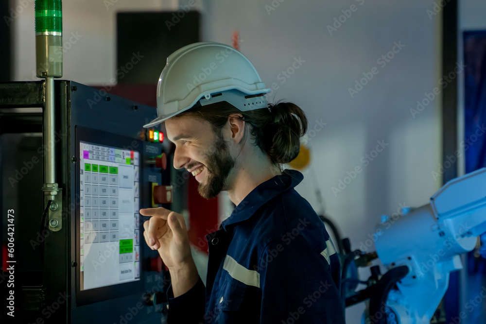 Poster Engineer looking at screen and programming about performance of robotic arm,Researching and Developing a Technological Robot Arm Project.