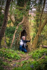 Male photographer taking pictures in the woods