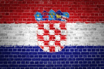 Closeup of the Croatia flag painted on a brick wall in an urban location