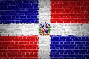 Closeup of the Dominican Republic flag painted on a brick wall in an urban location