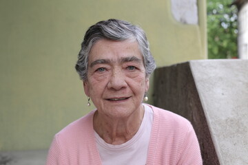 Senior woman with short gray hairstyle smiling 