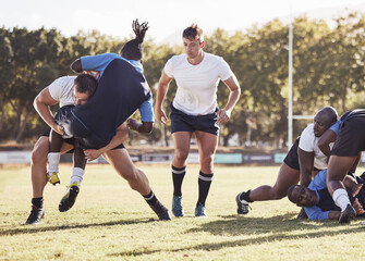 Rugby, sports and men tackle for ball on field for match, practice and game in tournament or competition. Fitness, teamwork and players playing on grass for exercise, training and performance to win