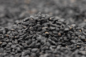Pile of black cumin as background, spice or seasoning as background. Kalonji, nigella sativa, black...