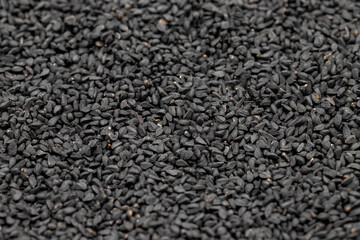 Pile of black cumin as background, spice or seasoning as background. Kalonji, nigella sativa, black...