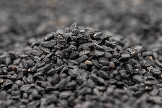 Pile of black cumin as background, spice or seasoning as background. Kalonji, nigella sativa, black cumin. Close up