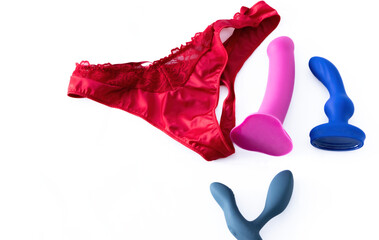 Sexual toys with red silk panties isolated on white background