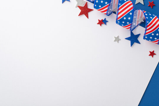 Patriotism-filled ambiance for July 4th. Top view showing symbolic party elements: twirled ribbon with American flag pattern, sparkling stars. Bicolor white and blue backdrop with space for text or ad