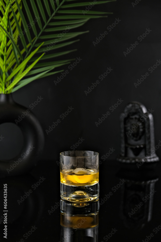 Wall mural Drink on Black Deep Background with Leaf Decoration