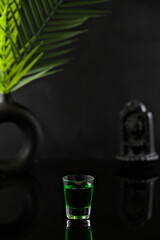 Drink on Black Deep Background with Leaf Decoration