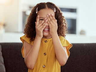 Hide and seek, kid and girl portrait with hands to face in a home with a smile. Game, fun and...