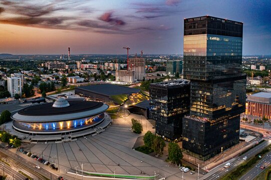 Katowice centre and office towers buildings and Spodek at evening. Aerial drone view. Katowice, Silesia, Poland