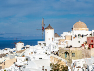 Stair stepped buildings and windmills of Santorini.