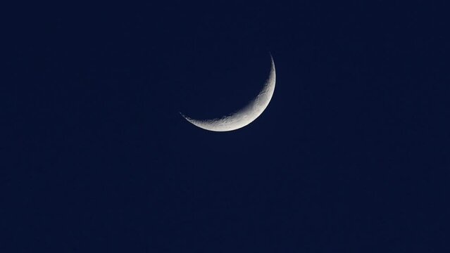 Close-up new moon at dusk.