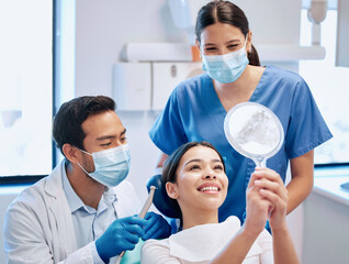 Dentist, mirror and woman check teeth after whitening, braces and dental consultation. Healthcare,...