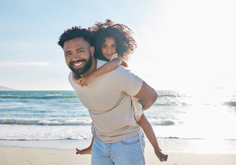 Father, girl child and piggyback on beach with travel, smile in portrait with love and people on...