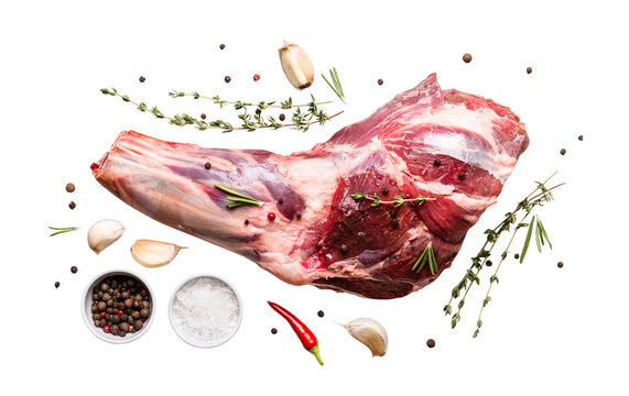 Raw fresh Lamb Meat shank, herbs and spices cut out on transparent background