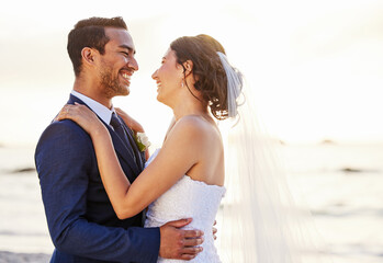 Wedding day, beach and couple hug at ocean for love, union and celebration on nature background....
