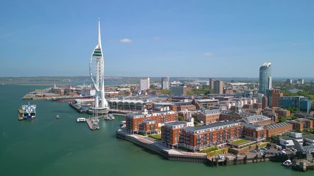 Drone aerial footage of spinning around Spinnaker Tower and Portsmouth Harbour. Portsmouth is a port city and unitary authority in Hampshire, England.