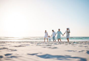 Fototapeta na wymiar Big family, holding hands and holiday on beach with mockup space for weekend or vacation. Grandparents, parents and kids walking together on the ocean coast for fun bonding or quality time in nature