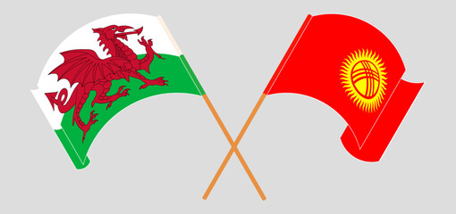 Crossed and waving flags of Wales and Kyrgyzstan