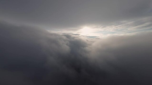 Aerial view Smoothly flying above the clouds. Pilot's point of view during a real flight before sunset. A bewitching look. Unique look. cloudscape